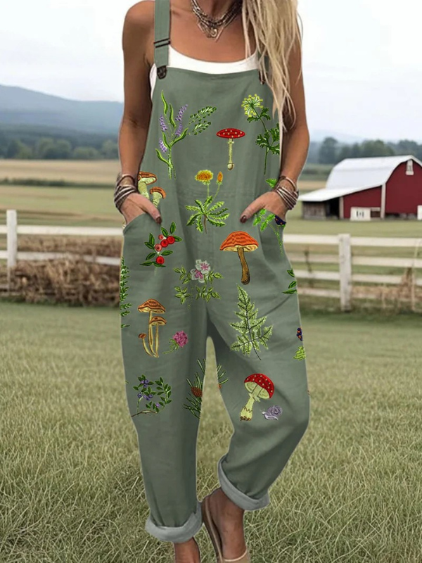 Olive green sleeveless jumpsuit with colorful nature embroidery mushrooms and leaves