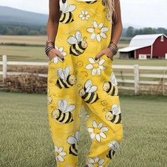 Yellow sleeveless jumpsuit with bee, flower, and cloud print, wide legs