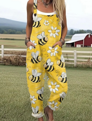 Yellow sleeveless jumpsuit with bee, flower, and cloud print, wide legs