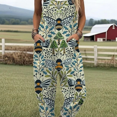 Blue sleeveless jumpsuit with floral vines and bee motif, wide legs
