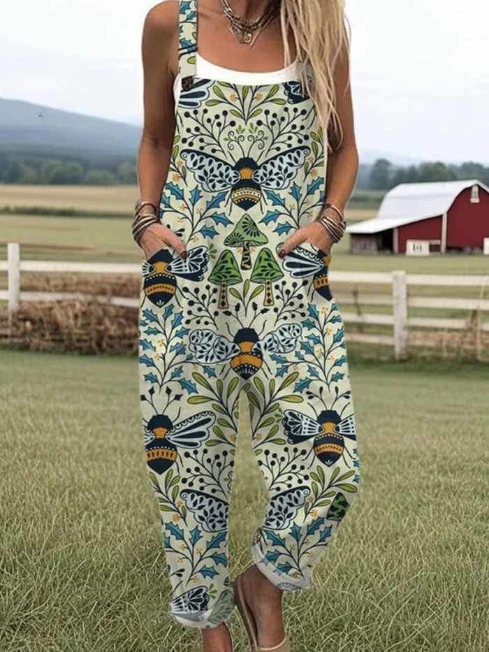Blue sleeveless jumpsuit with floral vines and bee motif, wide legs