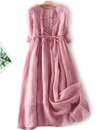 Women’s pink lace-up waist dress with round back and ruffled yoke detail