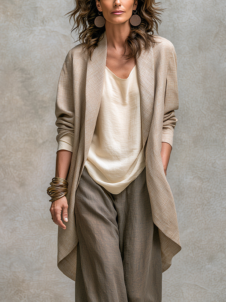 Three-piece palazzo set with textured open cardigan over a cream camisole and gray pants