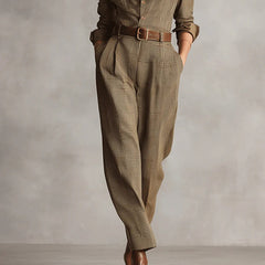 Brown plaid long-sleeve jumpsuit with waist belt and tailored cuffed legs