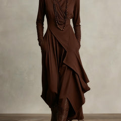 Brown long-sleeve maxi dress with high neck and asymmetrical draped panels