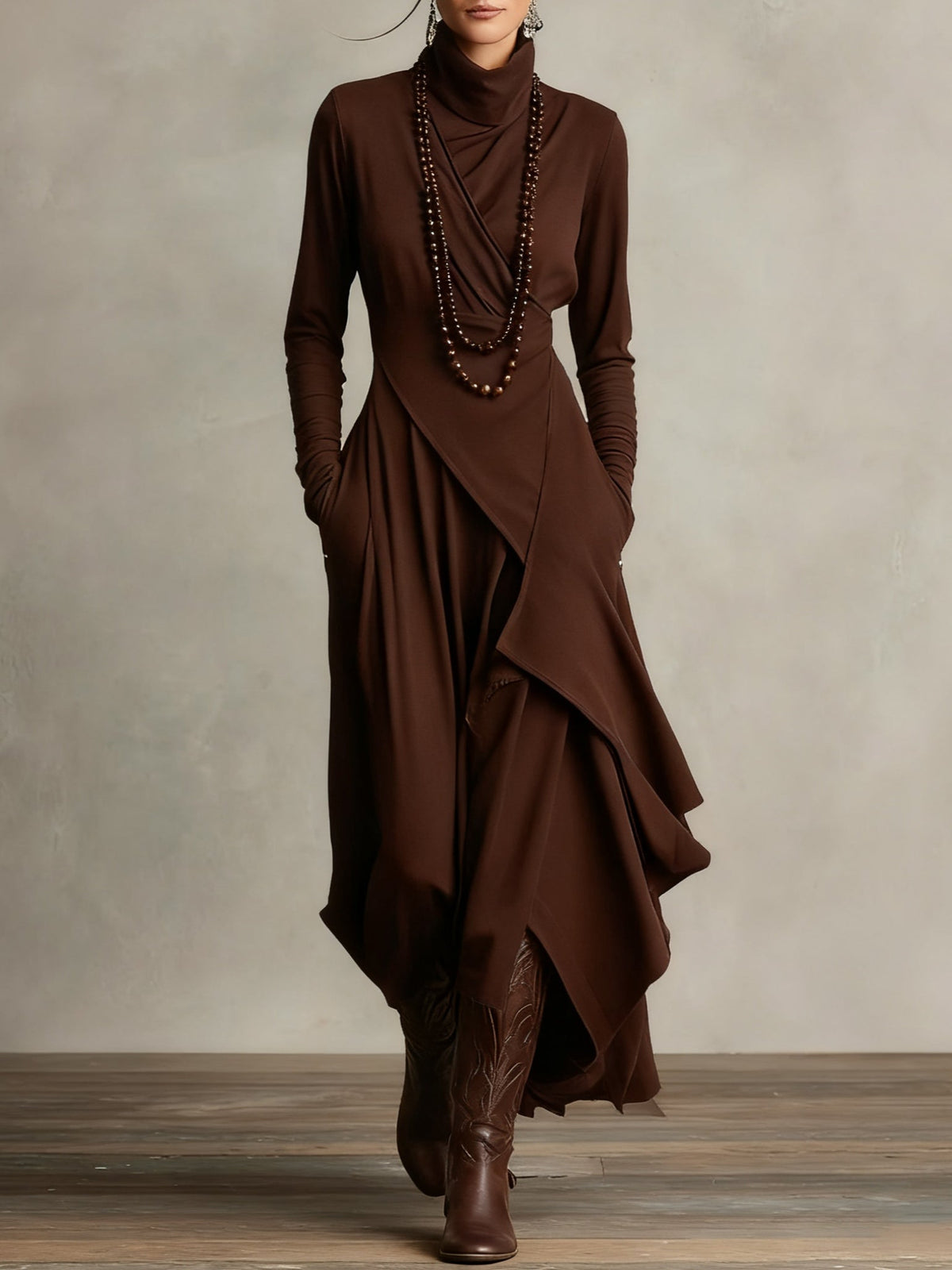 Brown long-sleeve maxi dress with high neck and asymmetrical draped panels