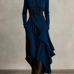 Navy blue long-sleeve maxi dress with high neck and layered wrap skirt