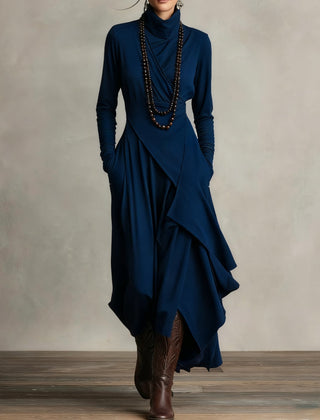 Navy blue long-sleeve maxi dress with high neck and layered wrap skirt