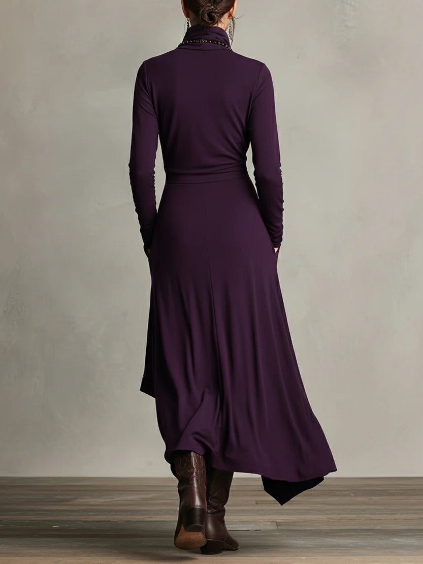 Purple long-sleeve maxi dress shown from back, draped wrap skirt
