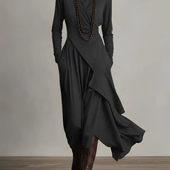 Black long-sleeve maxi dress with high neck and cascading drape wrap skirt