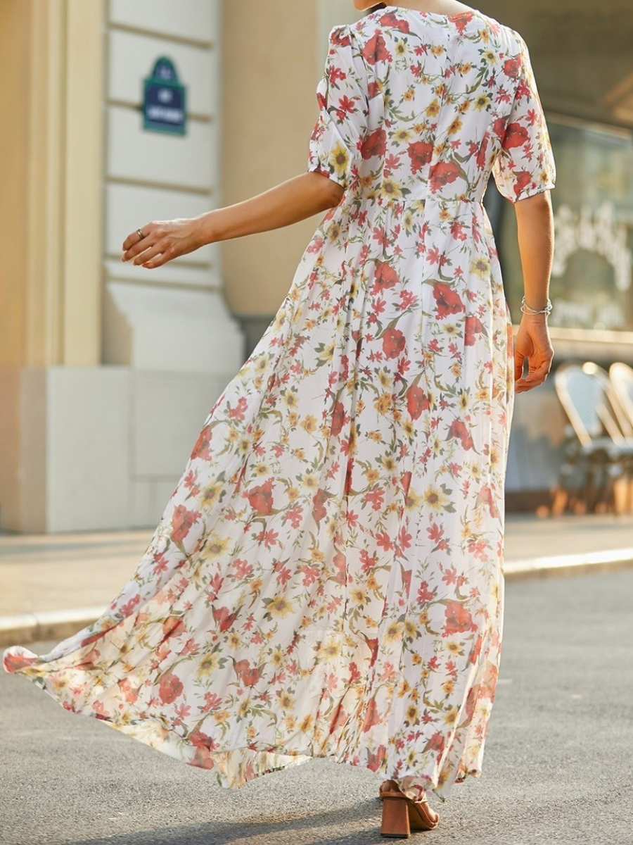 Floral romantic maxi dress with puff sleeves and round neckline, flowing full skirt