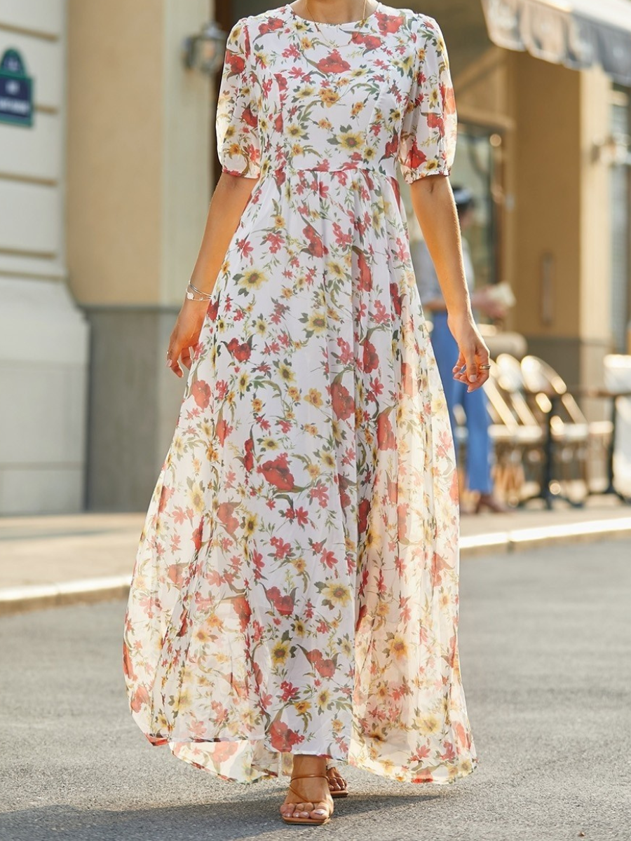 Floral maxi dress with short puff sleeves, round neck, and gathered waist silhouette