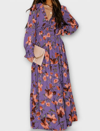 Purple floral maxi dress with V-neck, long sleeves, and side slit