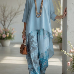 Light blue long tunic top and wide-leg printed pants set with layered hem and wide legs