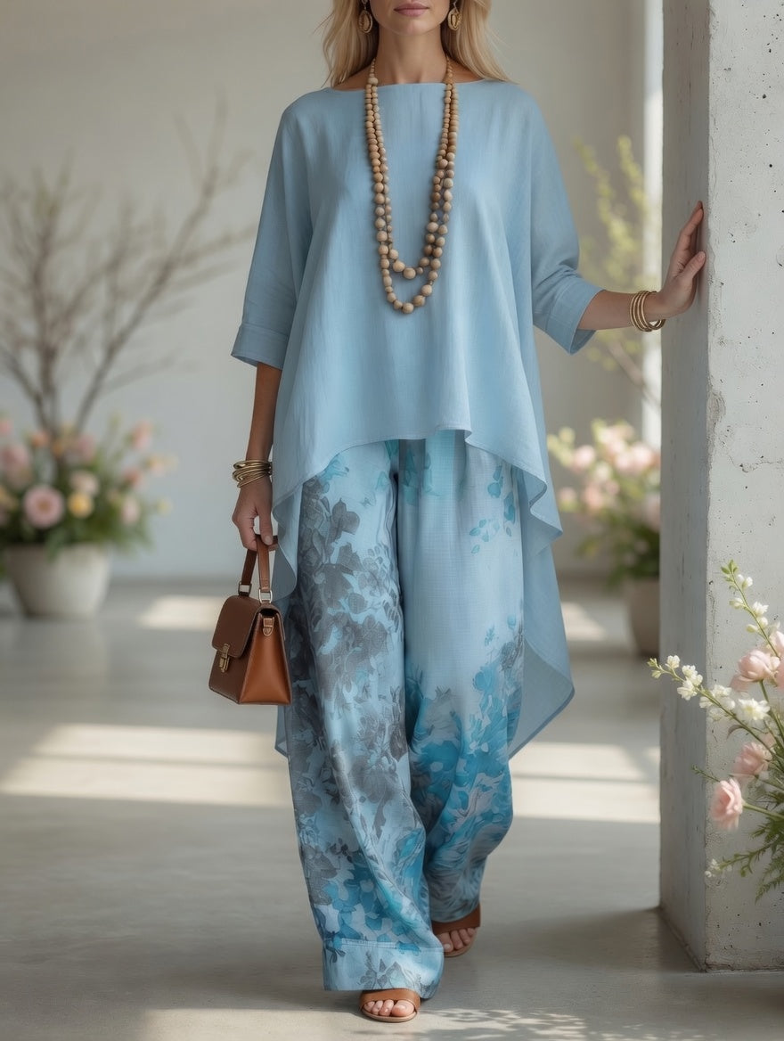 Light blue long tunic top and wide-leg printed pants set with layered hem and wide legs