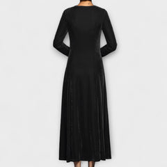 Black velvet dress back view with long sleeves and midi length flowy skirt
