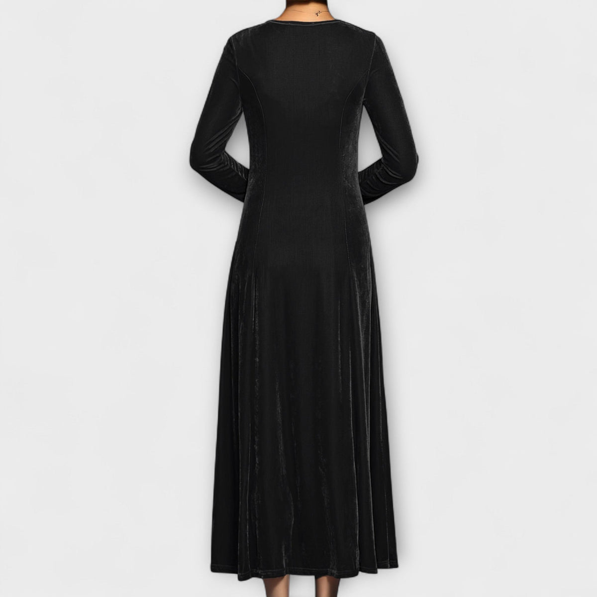Black velvet dress back view with long sleeves and midi length flowy skirt