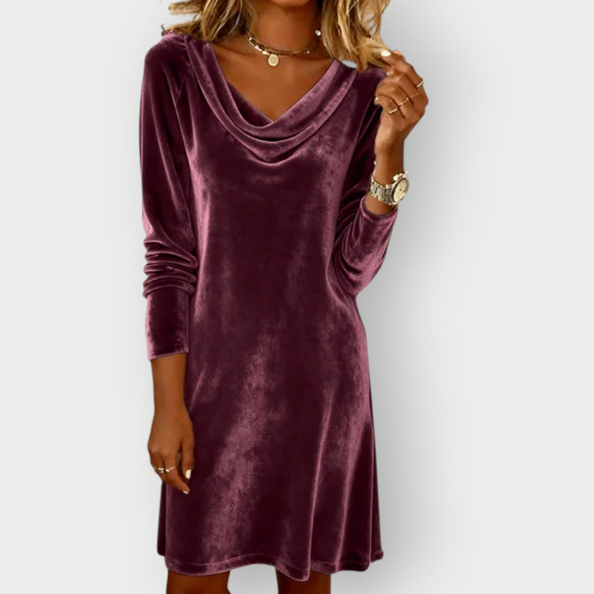 Purple velvet drape-neck shift dress with long sleeves and cowl neckline, knee-length look.