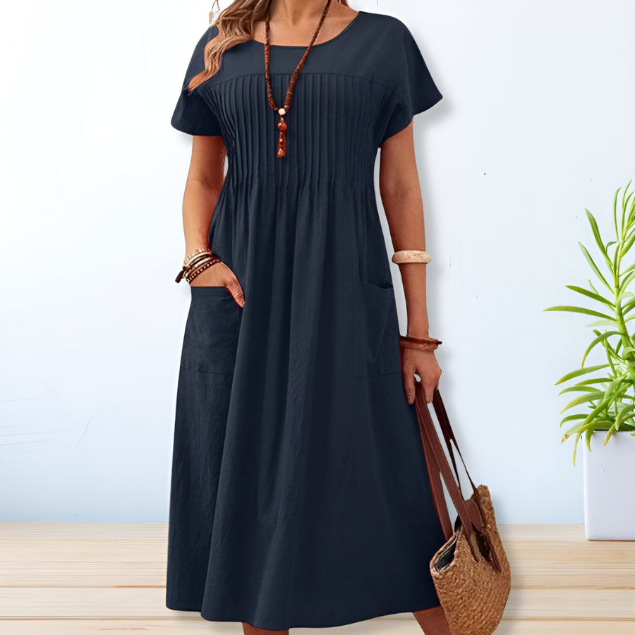Black short-sleeve dress with scoop neck, gathered bodice and side pockets