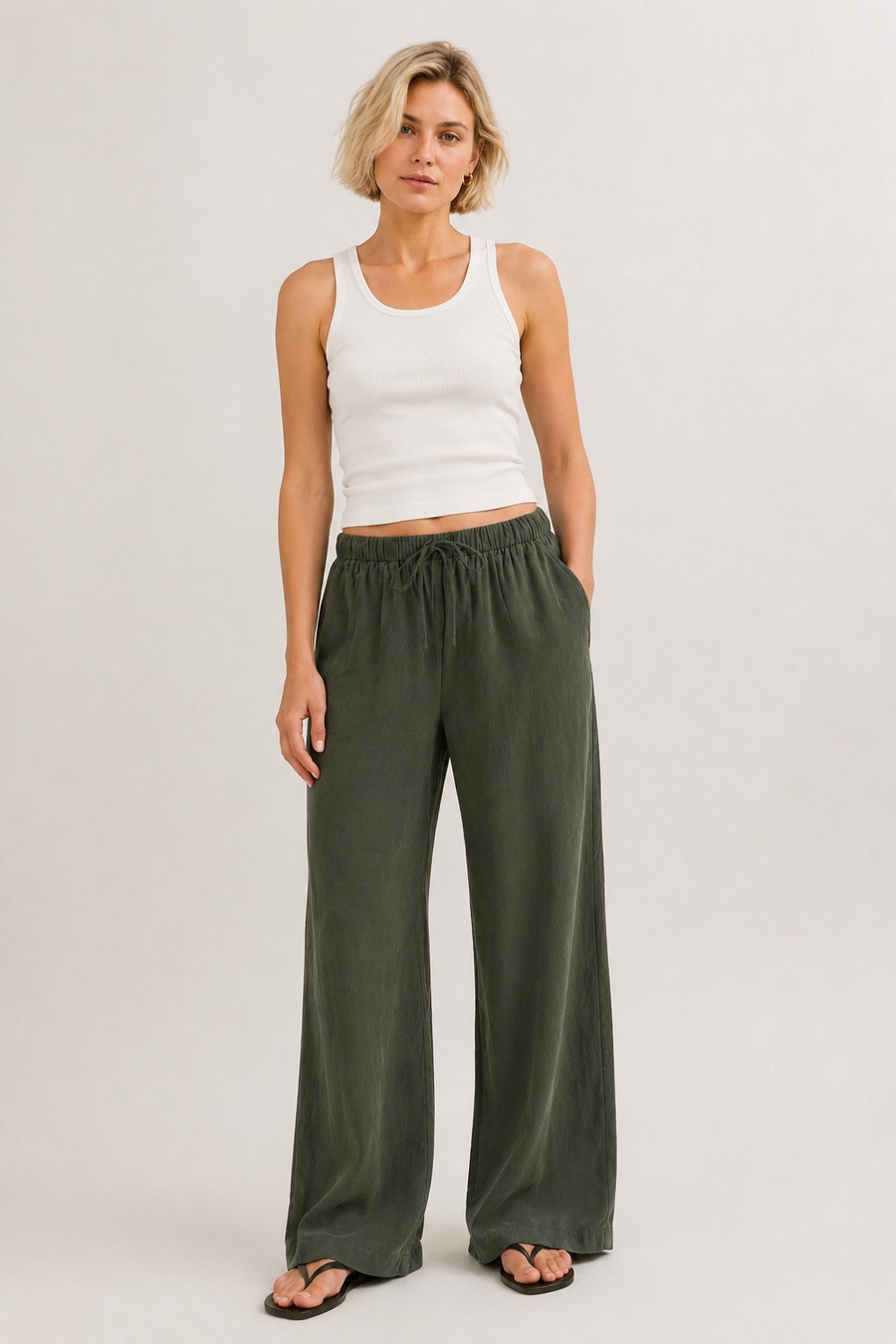 Brennan pants in dark green, wide-leg with elastic drawstring waist.