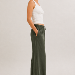 Dark green wide-leg drawstring pants with gathered elastic waist.
