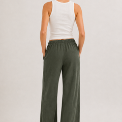 Dark green wide-leg pants with elastic drawstring waist and full-length relaxed fit.