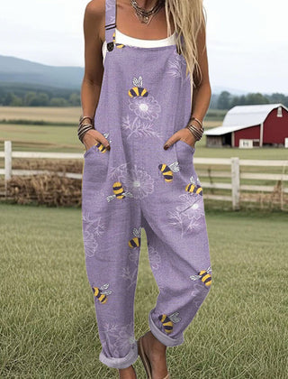 Purple sleeveless jumpsuit with bee-flower print, front pockets and straps