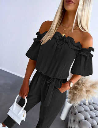 CAMILA™ off-shoulder frill tie-waist jumpsuit in black with ruffled off-shoulder detail