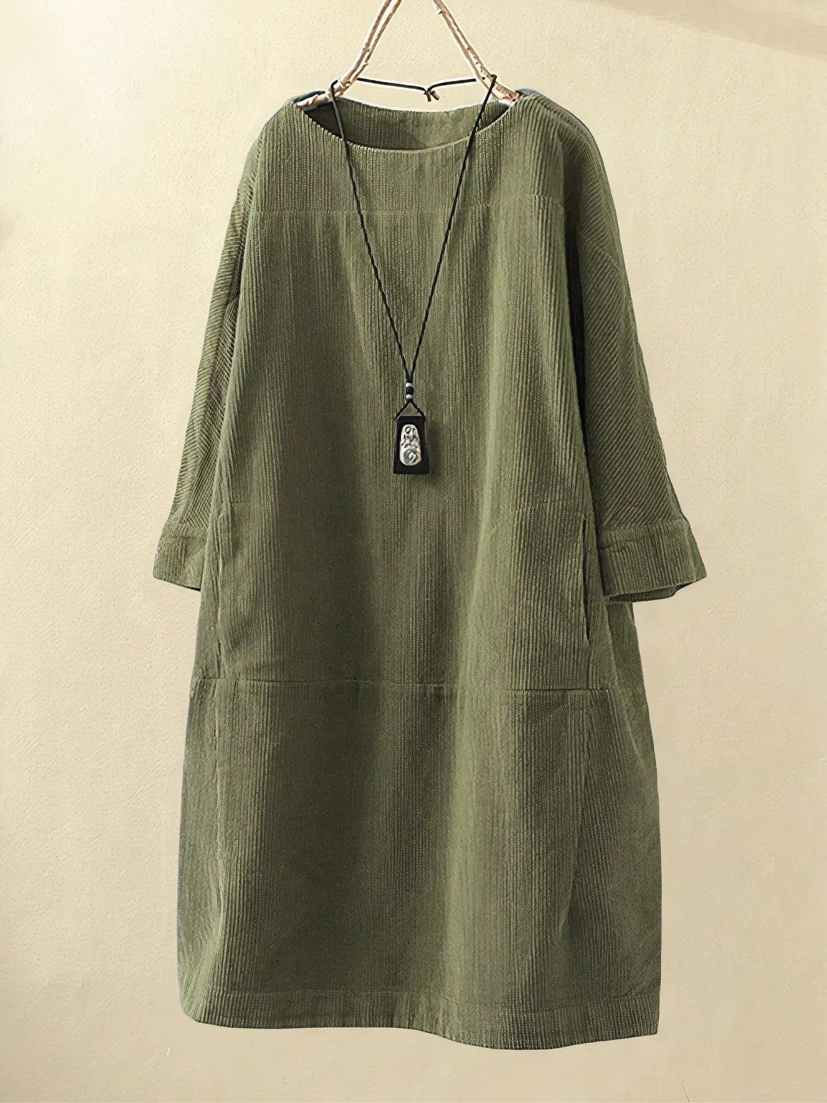 Dark green corduroy tunic dress with round neckline and 3/4 sleeves