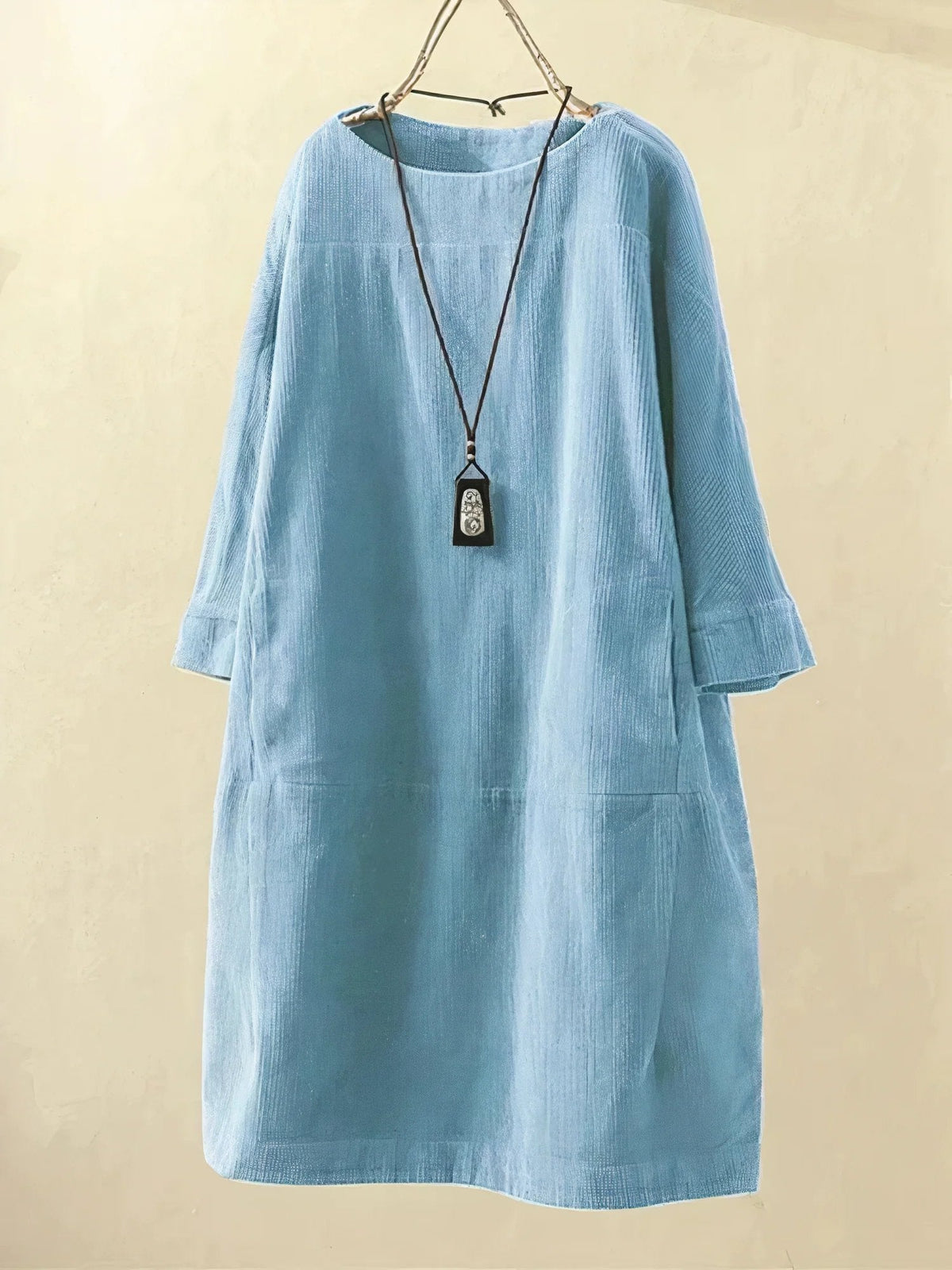 Light blue corduroy tunic dress with round neckline and 3/4 sleeves