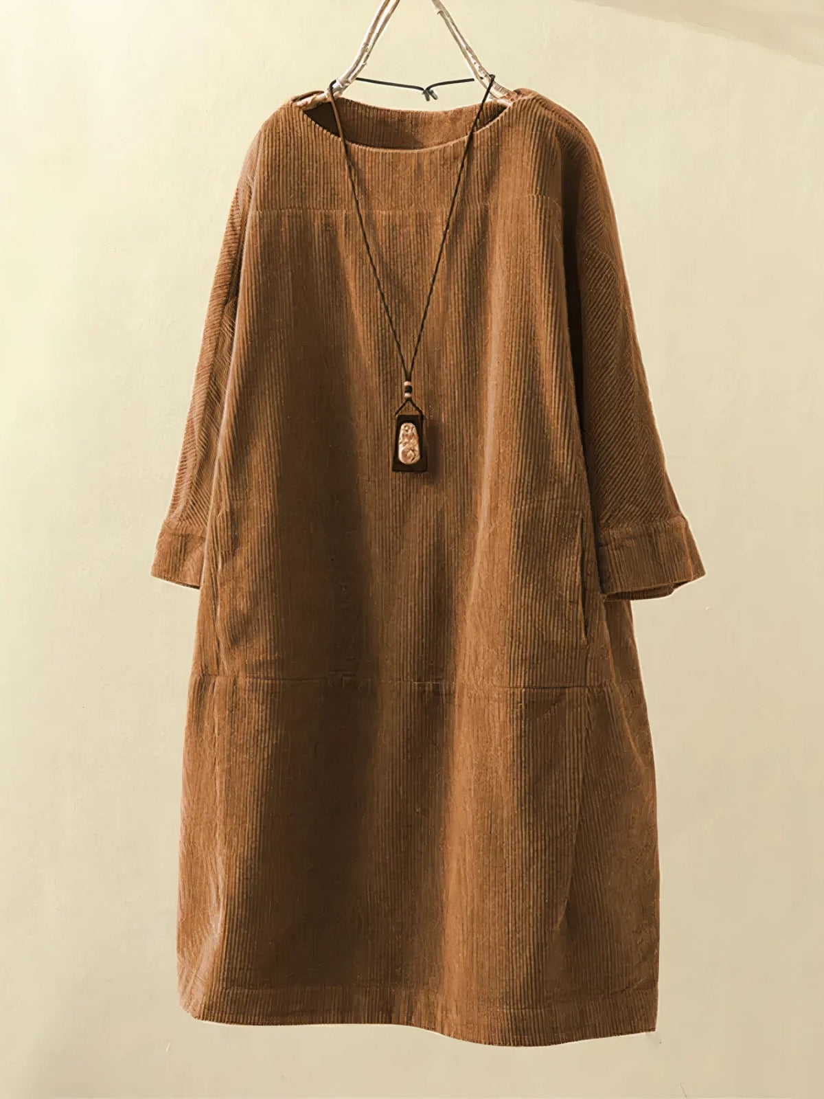 Brown corduroy tunic dress with round neckline and 3/4 sleeves