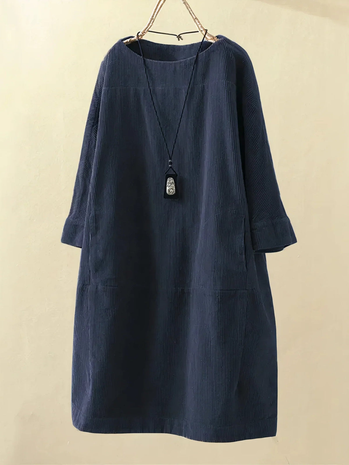 Dark blue corduroy tunic dress with round neckline and 3/4 sleeves
