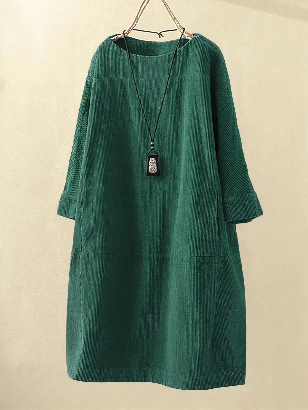 Green corduroy tunic dress with round neckline and 3/4 sleeves