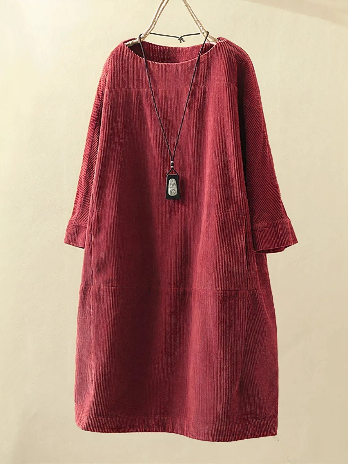 Red corduroy tunic dress with round neckline and 3/4 sleeves