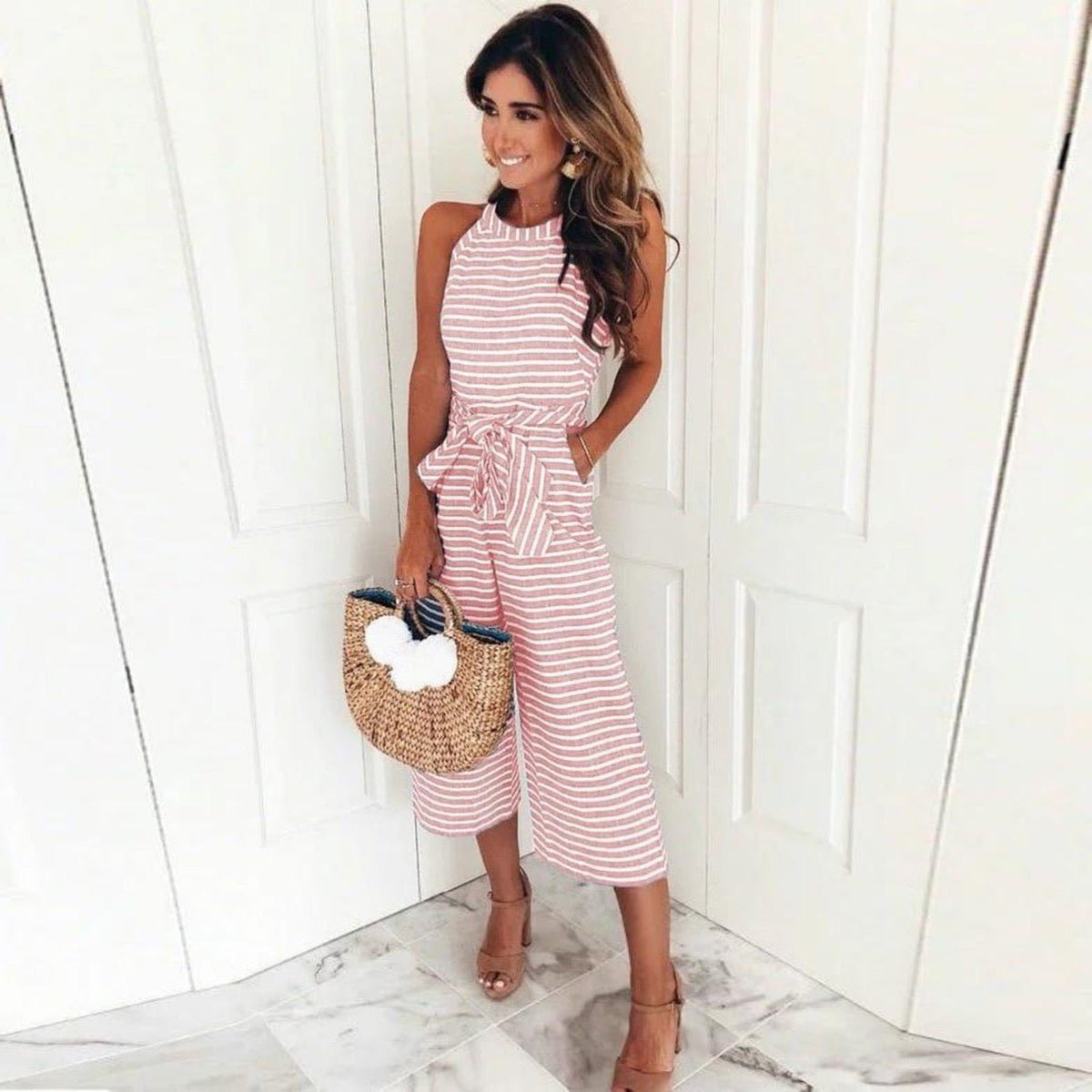 Juna striped jumpsuit in pink, sleeveless with round neck and tied waist