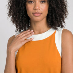 Orange sleeveless tunic dress with white crew neckline and contrast side panel trim