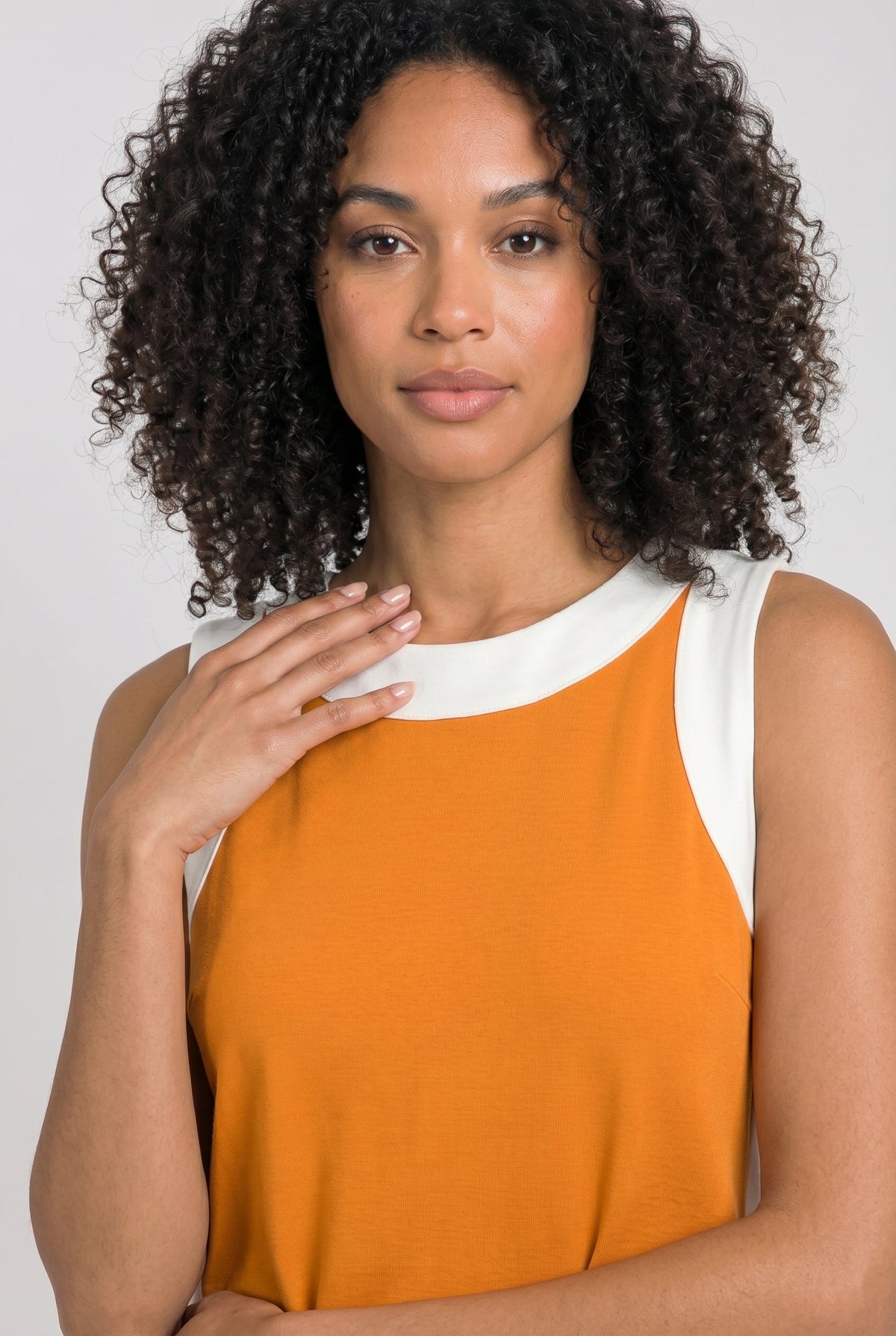 Orange sleeveless tunic dress with white crew neckline and contrast side panel trim