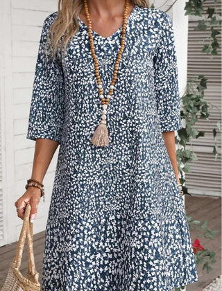 Boho Bloom dress with blue daisy print, three-quarter sleeves, scoop neck, tiered skirt