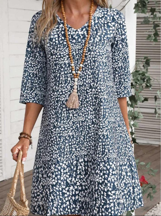 Boho Bloom dress with blue daisy print, three-quarter sleeves, scoop neck, tiered skirt