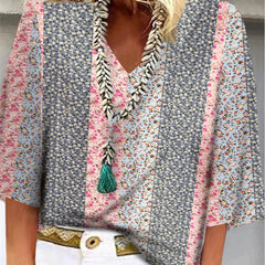 Multicolor floral-print blouse with V-neck, tassel trim, and flared sleeves