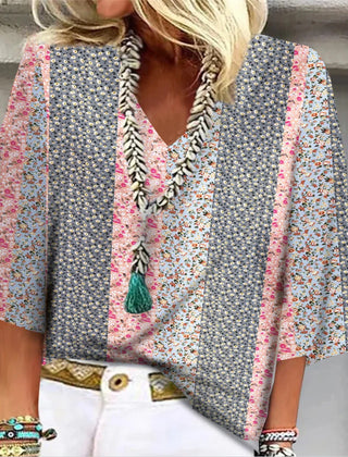 Multicolor floral-print blouse with V-neck, tassel trim, and flared sleeves