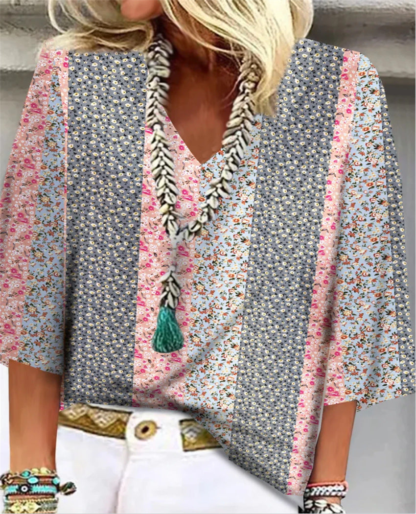 Multicolor floral-print blouse with V-neck, tassel trim, and flared sleeves