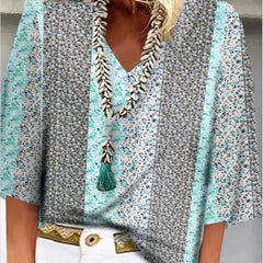 Multicolor floral-print blouse with V-neck tassel trim and flared sleeves