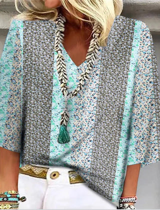 Multicolor floral-print blouse with V-neck tassel trim and flared sleeves
