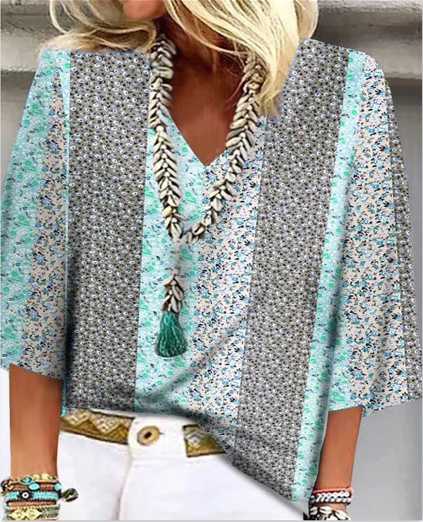 Multicolor floral-print blouse with V-neck tassel trim and flared sleeves