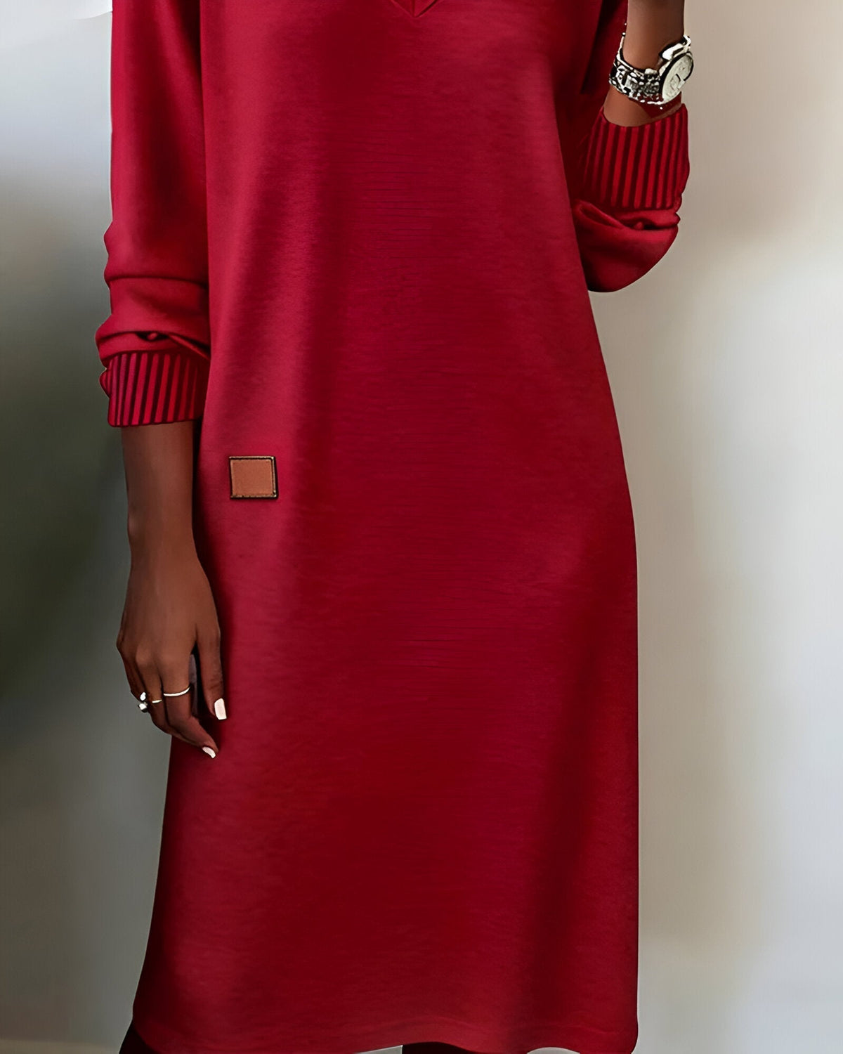 Red V-neck knit midi dress, square side patch and ribbed striped cuffs detail