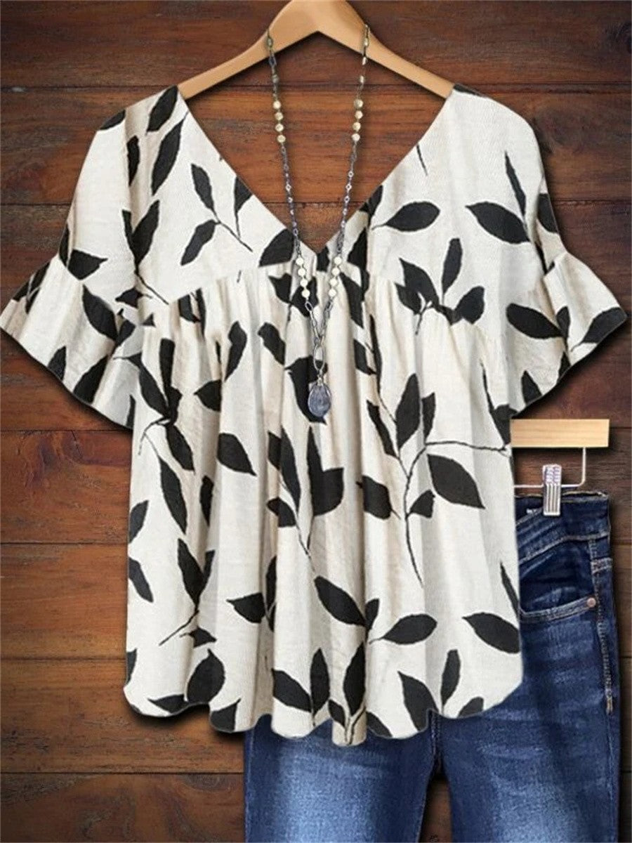 Ruffled leaf-print top with V-neck and short sleeves, white with black pattern