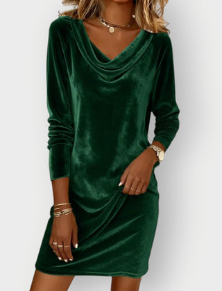 Green velvet drape-neck shift dress with long sleeves and cowl neckline, above-knee length.