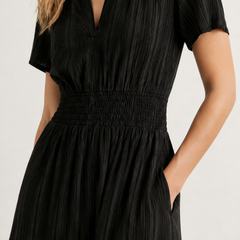 Black V-neck short-sleeve dress with smocked waist and tiered skirt