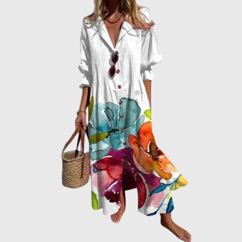 White bohemian dress with large colorful floral print, button-front V-neck, short sleeves